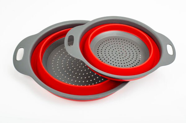 Bicolor collapsible colander on white background. Studio Photo Space-Saving Collapsible Colander
